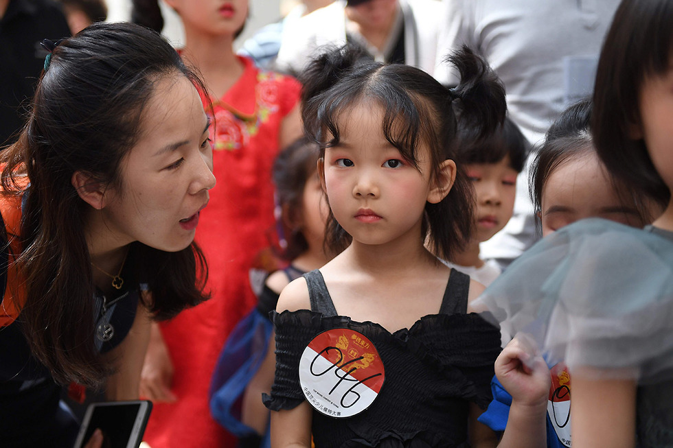 סין תעשייה ילדים ילדות דוגמנים דוגמניות דוגמנות אופנה (צילום: AFP)