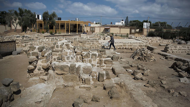 Palestinians work on a 4th century AD St. Hilarion monastery archaeological site in central Gaza Strip