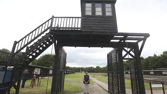 In this July 18, 2017 file photo the wooden main gate leading into the former Nazi German Stutthof concentration camp photographed in Sztutowo, Poland