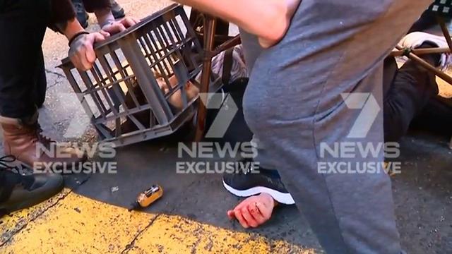Footage from Australian TV shows the knife-wielding man being brought down by passers-by