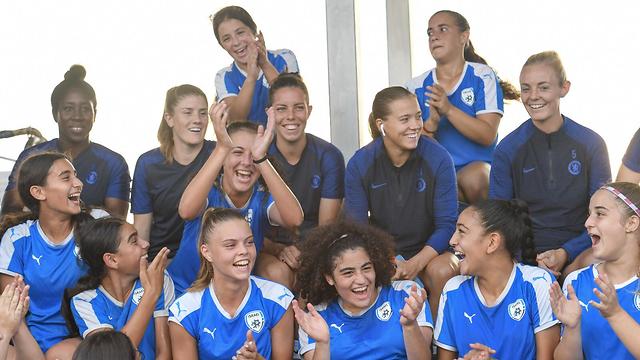 Players from Chelsea Women's football club with members of the Israeli Women's national squad 