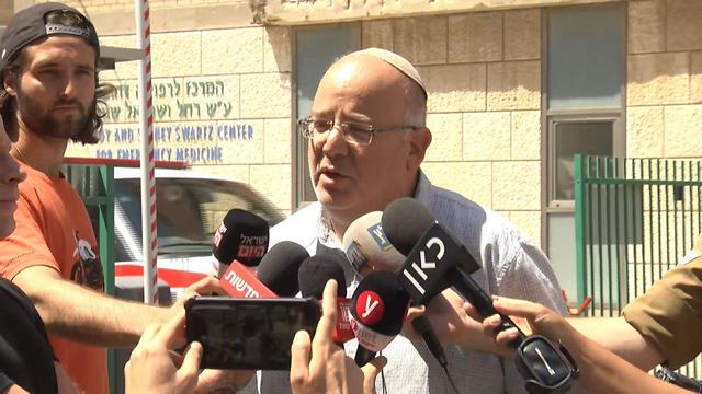 Rina Shnerb's uncle Shmulik Shenhav talks to reporters at the Jerusalem hospital where the victims were being treated (Photo: Shmulik Davidpur)