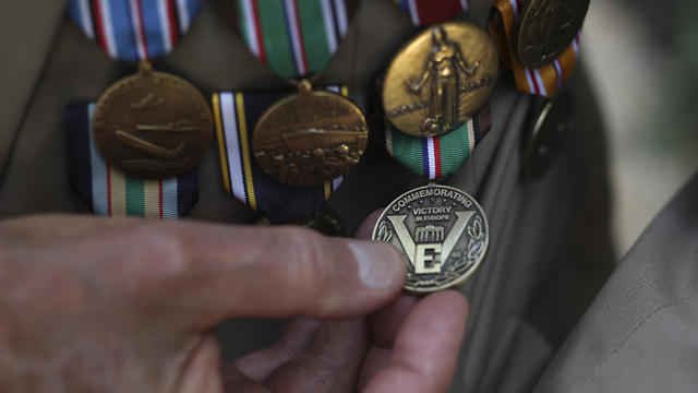 Donald Cobb, 95, of the US Navy, shows his medalsDonald Cobb, 95, of the US Navy, shows his medals