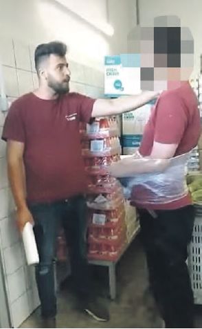 An image from a video shared online showing a Shufersal employee allegedly abusing a coworker