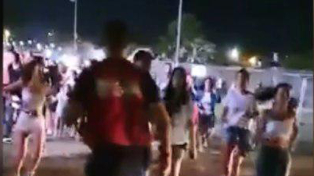 Crowds run during a Red Alert siren in Sderot