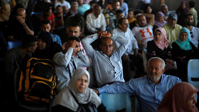 Palestinians wait for travel permits to leave Gaza (Photo: Reuters)