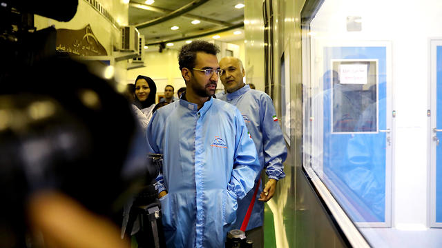 Iran's Minister of Information and Communications Technology Mohammad Javad Azari Jahromi looking at The Nahid-1 domestically-built satellite at the space research centre in Tehran, Iran, 31 August 2019
