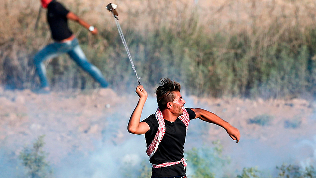 Palestinians protest along the Israel-Gaza border Friday (Photo: AFP)