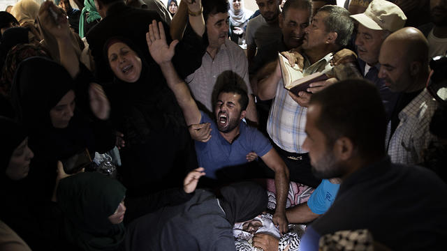 Mourners at Tamer al-Sultan's funeral in Gaza