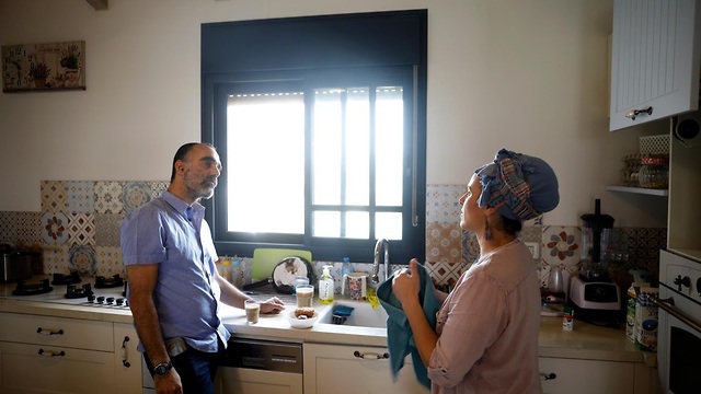 Itai Zar and Bat-Zion Zar talk in the kitchen of their home (Photo: Reuters)