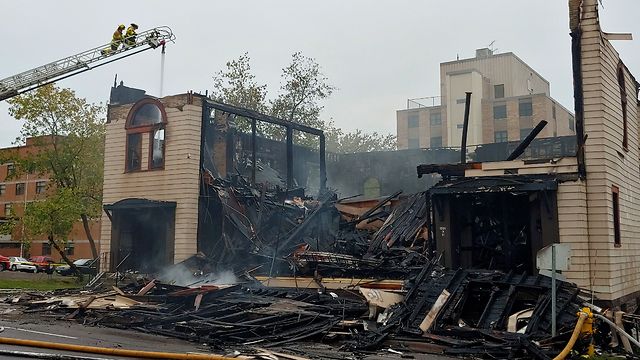 Firefighters work at the scene of an overnight fire that engulfed and destroyed the Adas Israel Congregation synagogue in downtown Duluth, Sept. 9, 2019  
