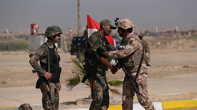 Iraq Syria border guards at opening of crossing
