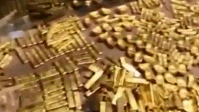 סין פקיד מושחת שמר 12.5 טונות זהב בבית (צילום: youtube)