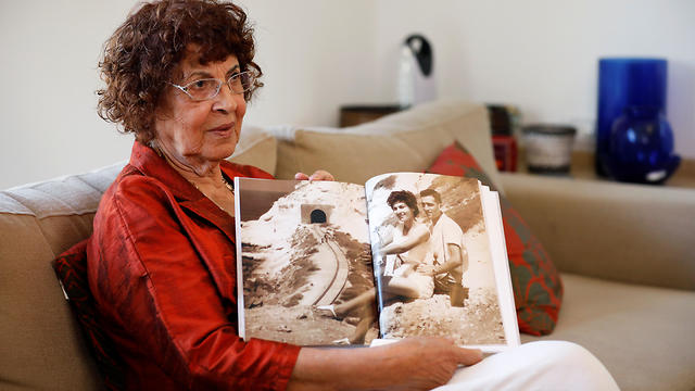 Nadia, widow of Israeli spy Eli Cohen, shows a photograph of herself with her late husband