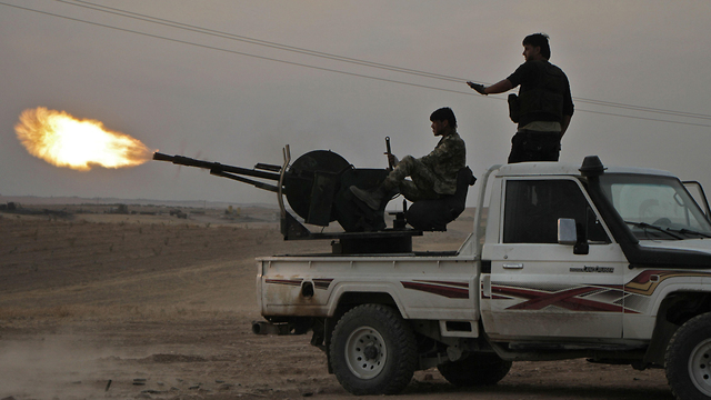 Turkish forces with militias outside the Kurdish town of Manbij (Photo: AFP)