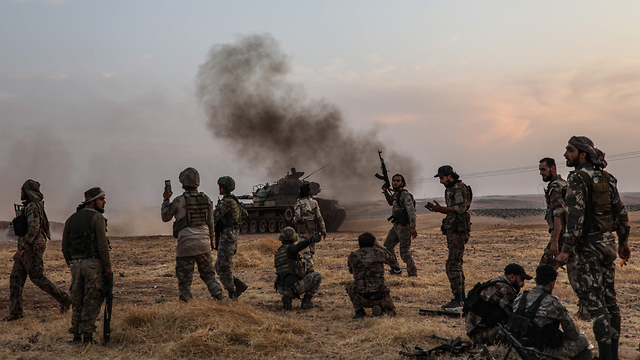 Turkish forces and their Syrian rebel allies advance on a Kurish city in nothern Syria (Photo: AFP)