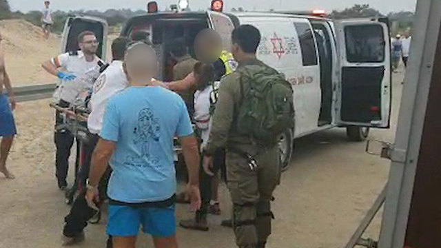 The injured being evacuated from the beach (Photo:  Barel Efraim)