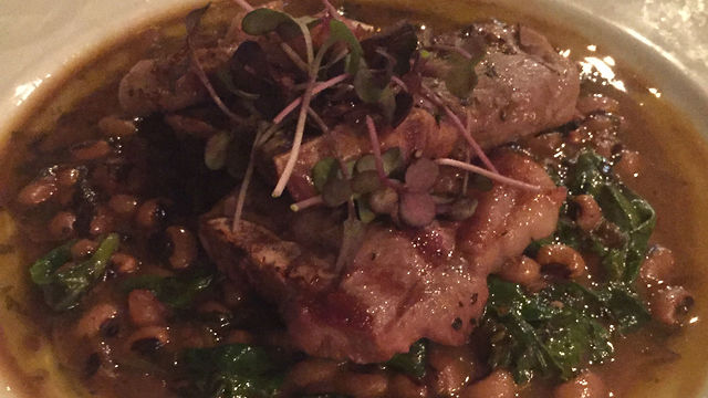 Jaffa lamb ribs with a stew of black-eyed peas, spinach and sundried tomatoes