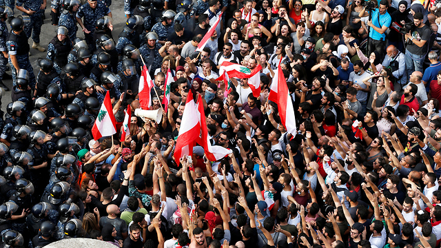 Lebanese protesters clashing with police in Beirut  (Photos: Reuters)