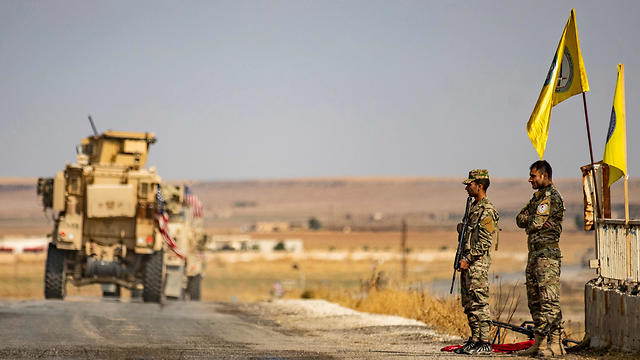 U.S. military vehicles in the Syrian town of Tal Tamr after pulling out of their base, Oct. 20, 2019 