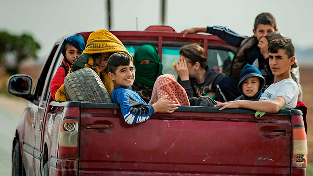 פליטים כורדים (צילום: AFP)