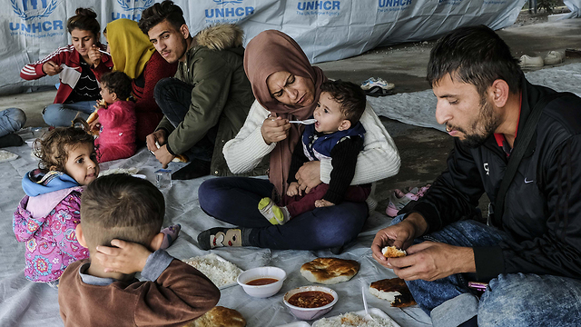 פליטים כורדים שברחו מ צפון סוריה למחנה ב עיראק (צילום: gettyimages)