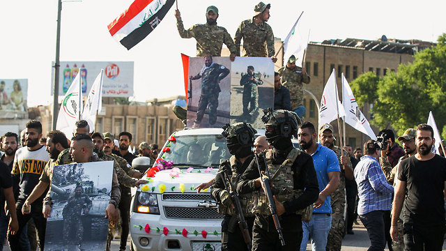 עיראק מיליציה אל חשד א שעבי בגדד (צילום: AFP)