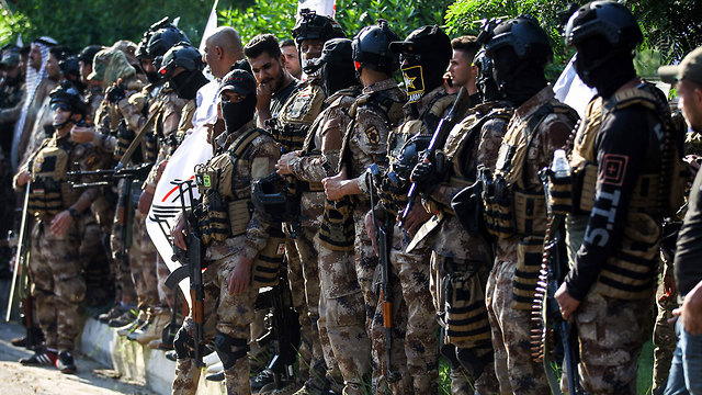 עיראק מיליציה אל חשד א שעבי בגדד (צילום: AFP)