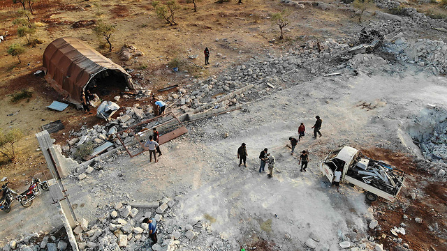 הרס ב כפר בארישא (צילום: AFP)