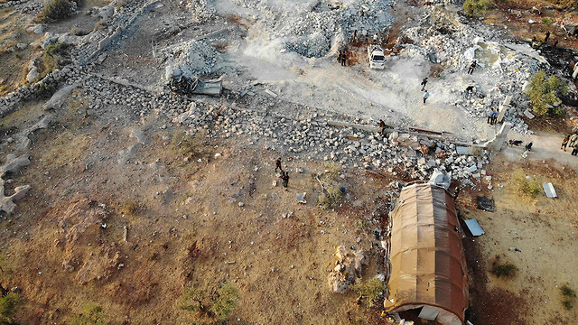 הרס ב כפר בארישא (צילום: AFP)