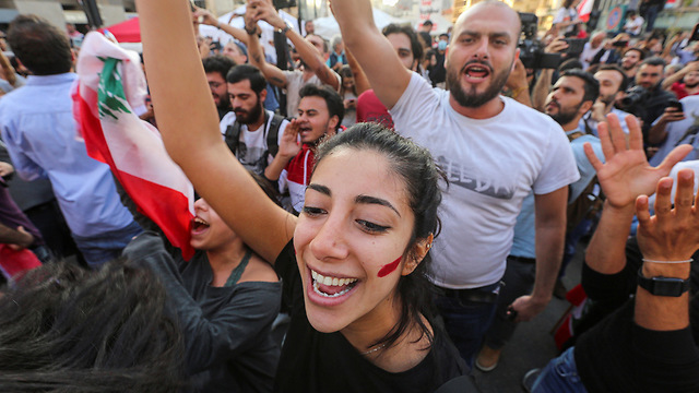 Lebanese protesters celebrate in Beirut at news of PM Saad Hariri's resignation (Photo: Reuters)