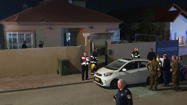 Security personnel outside the Sderot home hit by rocket fire Friday night (Photo: Roei  Idan)