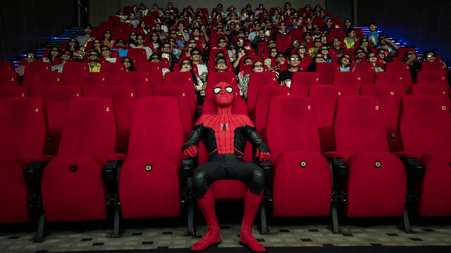 Man in a Spiderman costume during a screening of the franchise's latest fillm in Nepal, July (Photo: EPA)