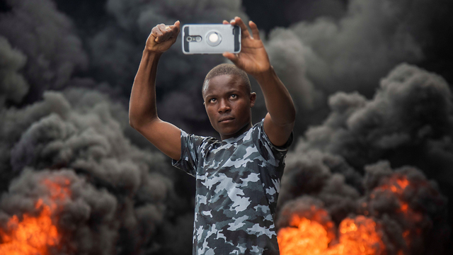 A protestor taking a selfie during a demonstration against the government in Haiti, February (Photo: EPA)
