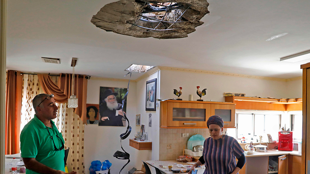 The home of the Hadad family sustained a direct hit from a rocket fired from Gaza  (Photo: AFP)