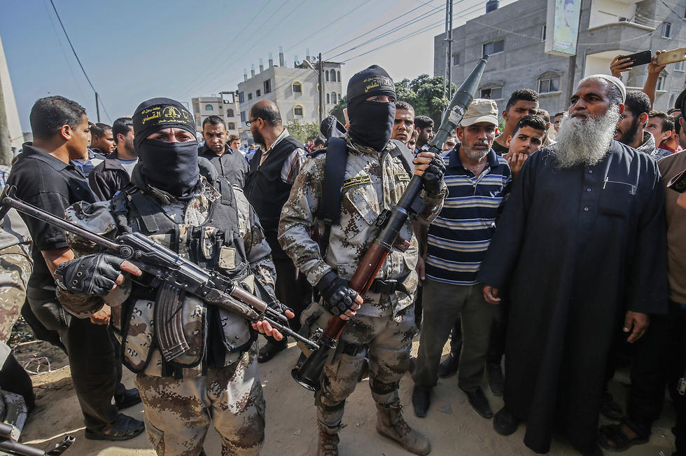 Islamic Jihad militants participate in funerals of killed comrades in Gaza (Photo: AFP) (צליום: AFP)