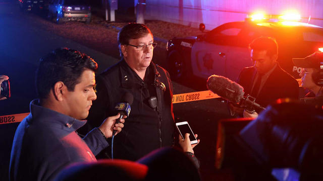 Lt. Bill Dooley of the local police speaks to reporters at the scene of a shooting in Fresno, California