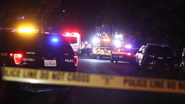Police and emergency vehicles at the scene of a mass shooting in Fresno, California