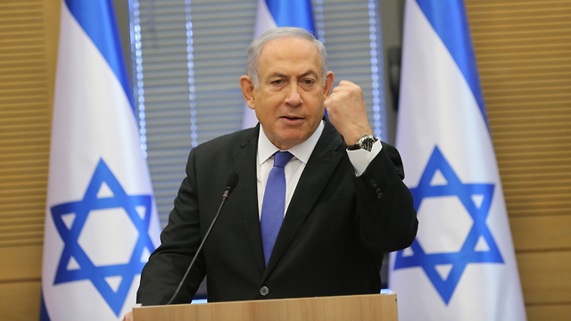 Prime Minister Benjamin Netanyahu speaks at the start of a meeting of his right-wing bloc in Jerusalem (Photo: Alex Kolomoisky)