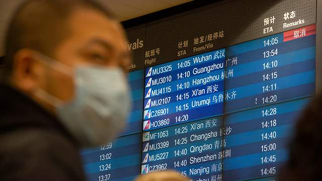 סין נמל תעופה בייג'ינג לוח טיסות בוטלו טיסות מ ווהאן נגיף קורונה (צילום: AP)