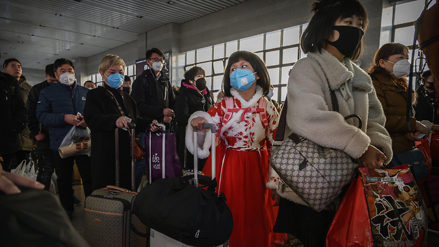 חגיגות השנה החדשה בסין בצל וירוס הקורונה (צילום: gettyimages)