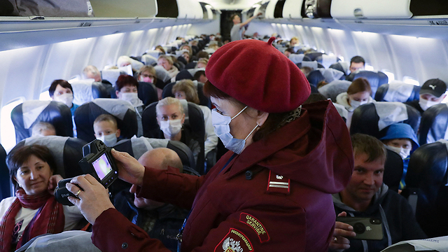 Измерение температуры и маски: рейс "Аэрофлота" из Китая. Фото: MCT