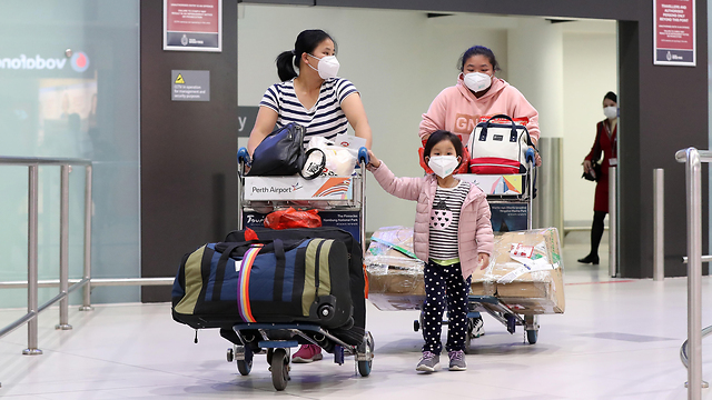 נוסעים טיסה שדה תעופה אוסטרליה נגיף וירוס קורונה ווהאן סין (צילום: gettyimages)