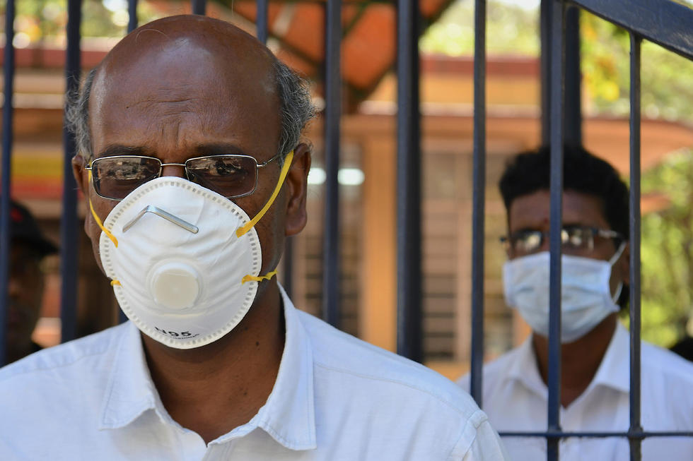 בנגלור ב הודו מסכה  מחשש ל נגיף וירוס קורונה (צילום: AFP)