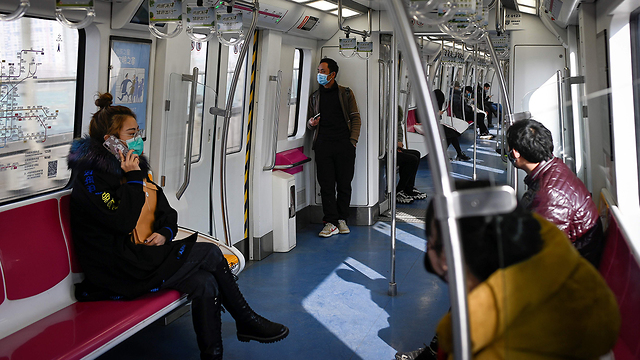 סין בייג'ינג חוזרים ל עבודה בצל נגיף קורונה רכבות ריקות (צילום: AFP)