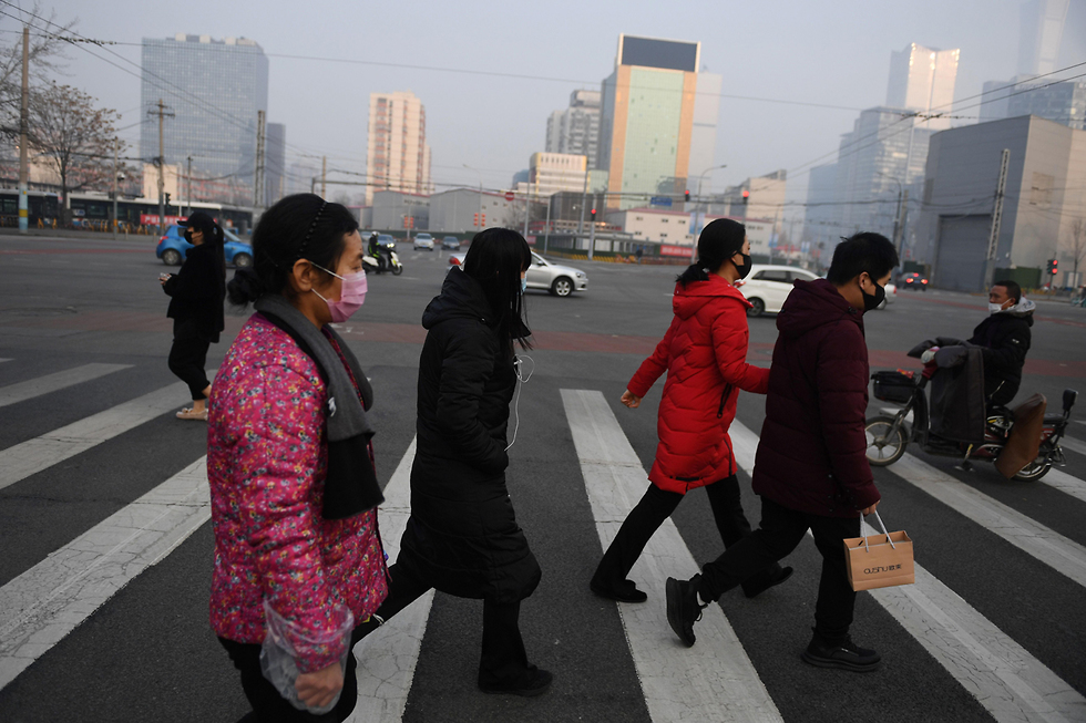 נגיף קורונה ברחובות בייג'ינג (צילום: AFP)