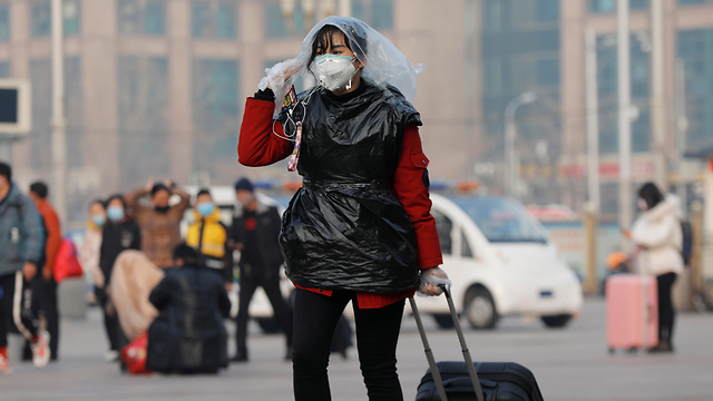 נגיף קורונה ברחובות בייג'ינג (צילום: EPA)