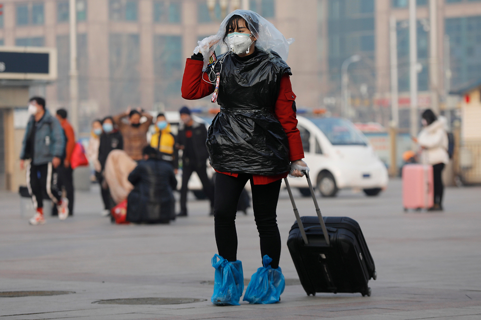 נגיף קורונה ברחובות בייג'ינג (צילום: EPA)