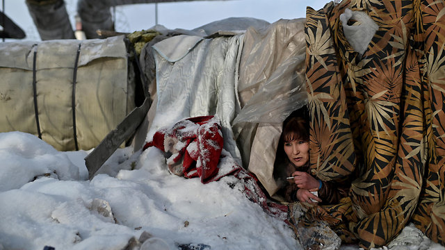 להיות הומלס חסר בית ב סיביר רוסיה גליה מקלט מאולתר של אלכסיי (צילום: רויטרס)
