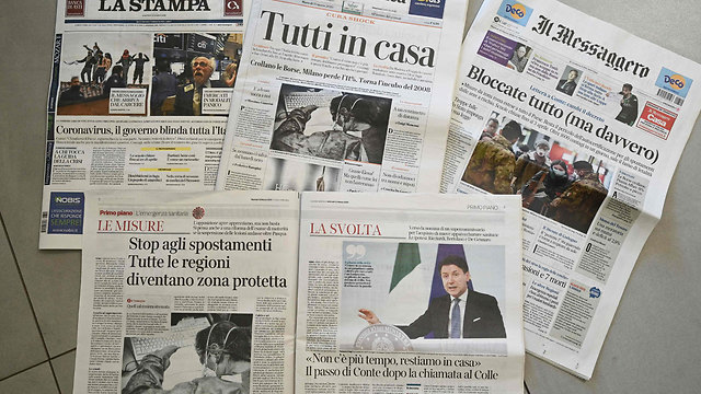 נגיף קורונה סגר על איטליה כותרות עיתונים (צילום: רויטרס)